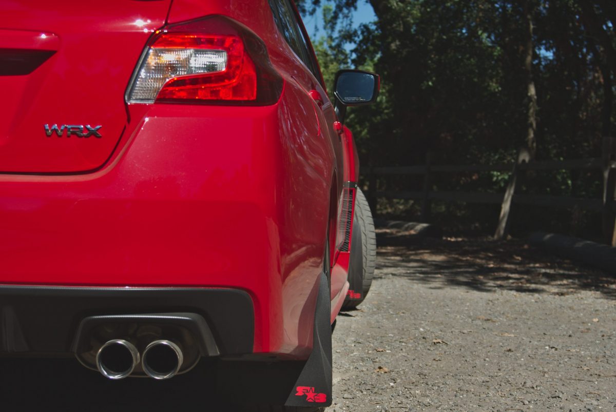 Subaru WRX with mufflers and exhaust tips visible