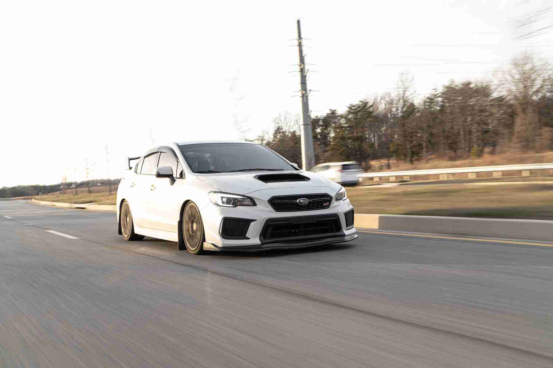White Subaru WRX STI lowered on coilovers