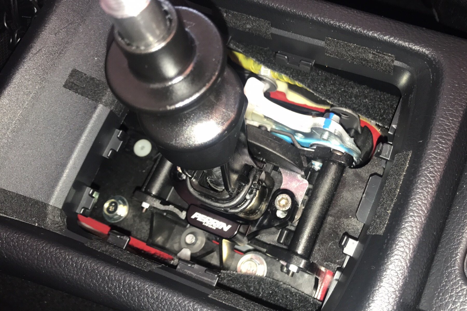 WRX shifter stop installed near shifter assembly