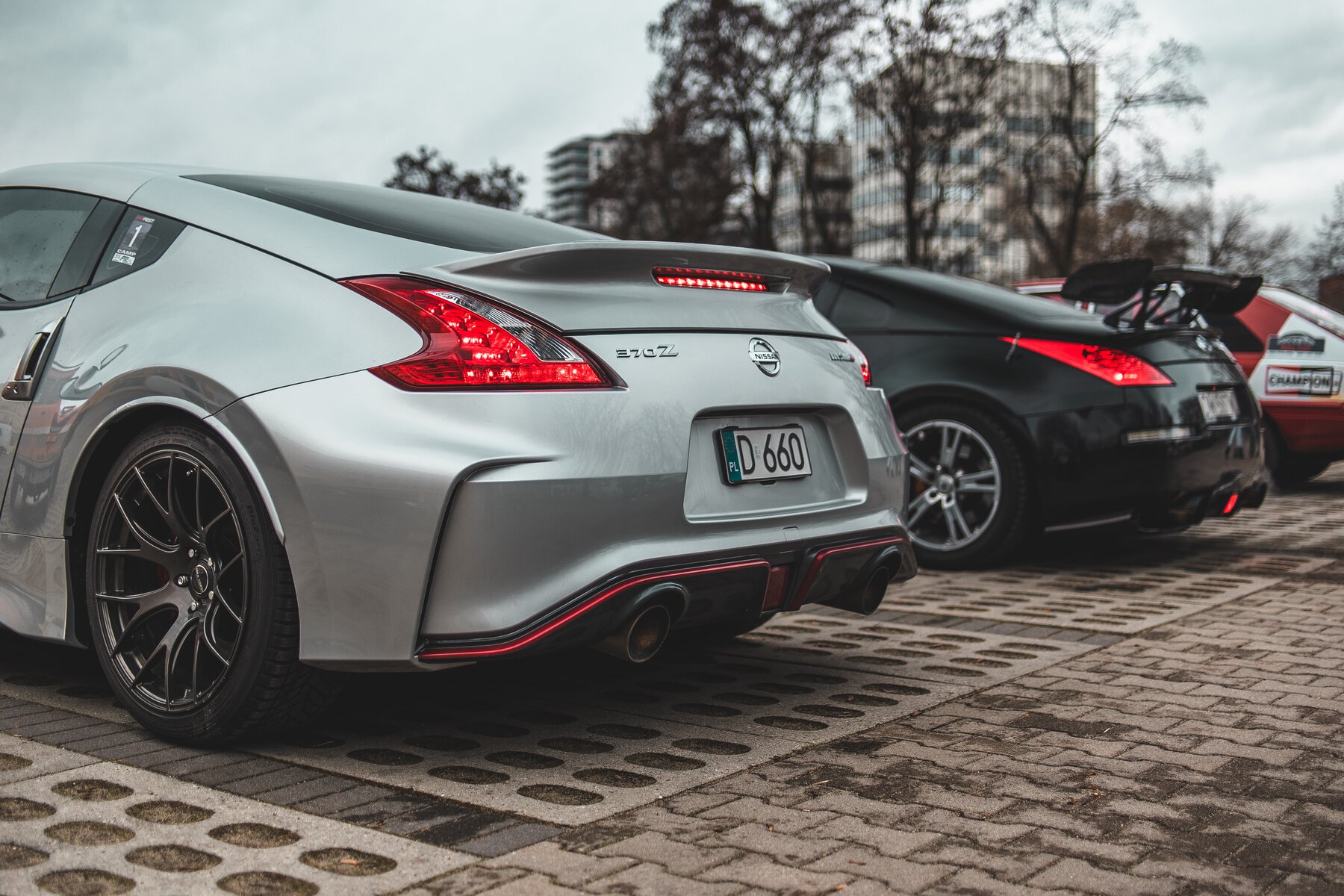 rear end of two 370z with rear tires visible