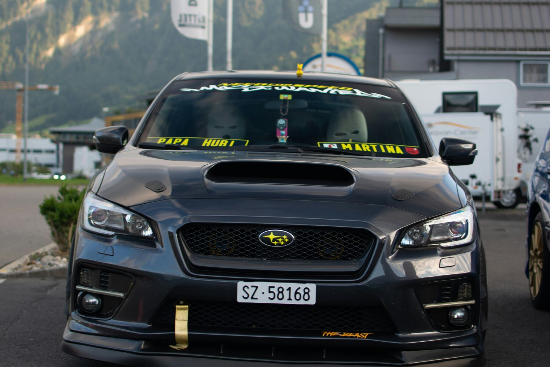Modified Subaru WRX parked in a mountain paddock