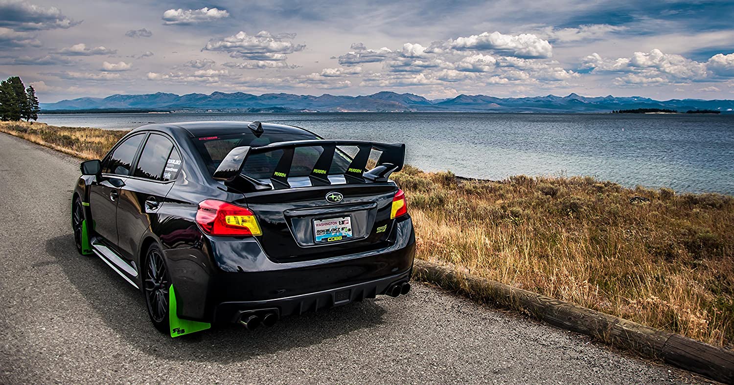 Green RokBlokz mud flaps on a black Subaru WRX STI